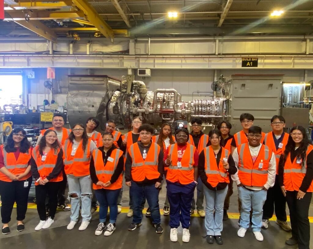 group of high school students from UW San Diego County STEAM to Careers program wearing orange vests on a field trip
